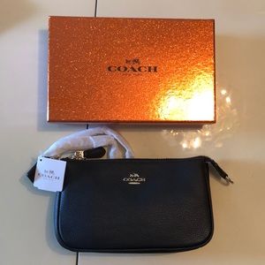 Black and gold Coach wristlet